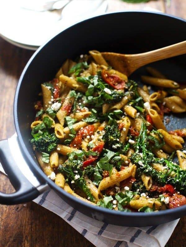 20 Minute Lemon Pesto Penne - baby broccoli, oven roasted tomatoes, pesto, fresh lemon, feta, and basil. My husband says it's his new favorite. | pinchofyum.com
