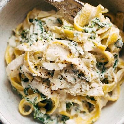 Creamy Kale Pasta in a bowl with a fork.