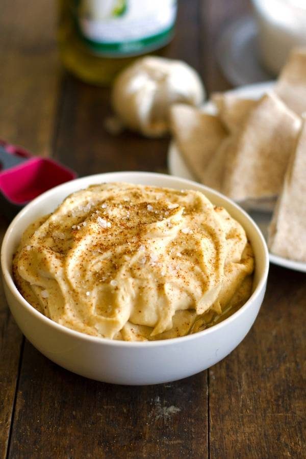 Hummus in a white bowl.